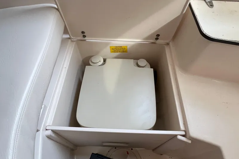 Slide: The Image of Storage compartment in a 2004 Grady-White Gulfstream 232 boat interior. - 28