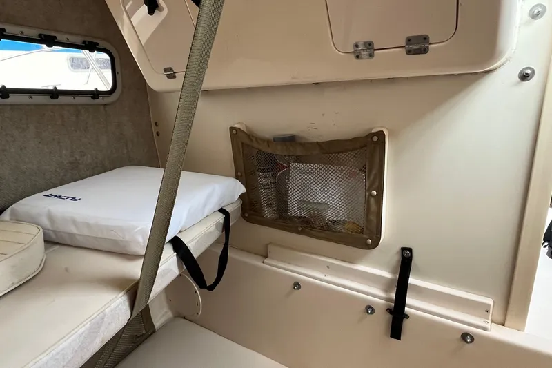 Slide: The Image of Interior cabin of 2004 Grady-White Gulfstream 232 boat with storage and seating. - 30