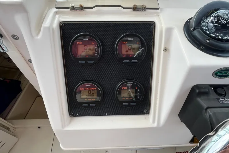 Slide: The Image of Dashboard of 2004 Grady-White Gulfstream 232 with Yamaha gauges and compass. - 32