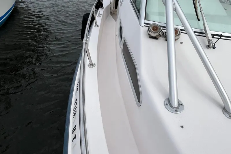 Slide: The Image of 2004 Grady-White Gulfstream 232 boat deck with railing and window detail. - 37