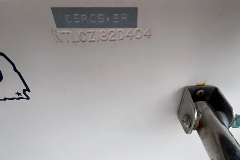 Slide: The Image of 2004 Grady-White Gulfstream 232 boat hull identification number and metal fitting. - 38