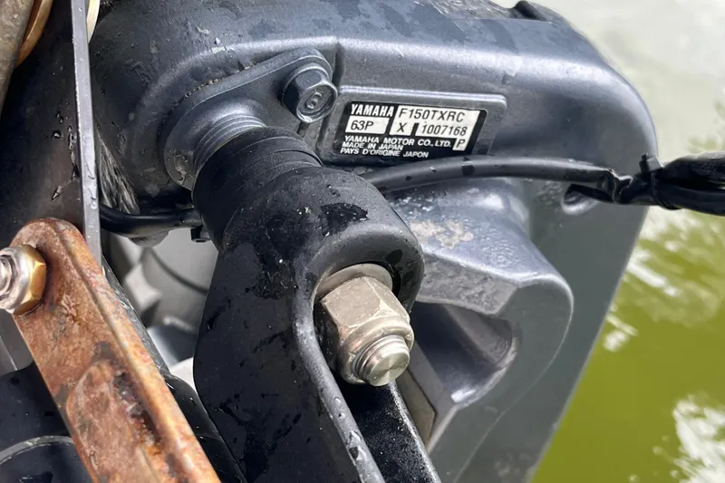 Slide: The Image of Close-up of Yamaha F150TXRC engine on 2004 Grady-White Gulfstream 232 boat. - 39