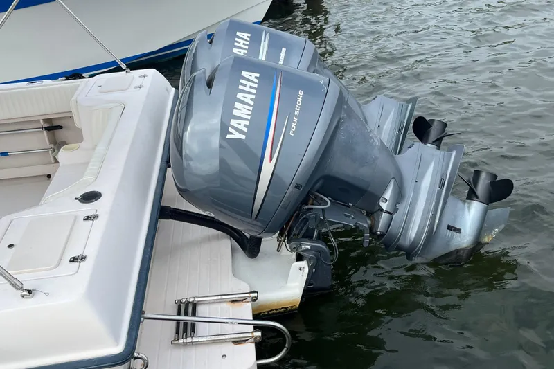 Slide: The Image of 2004 Grady-White Gulfstream 232 with twin Yamaha outboard motors on water. - 4