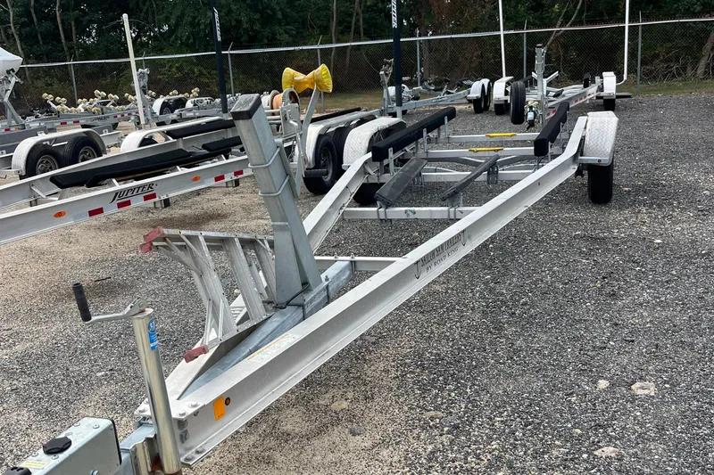 Slide: The Image of Boat trailer for 2004 Grady-White Gulfstream 232, parked on gravel lot. - 41