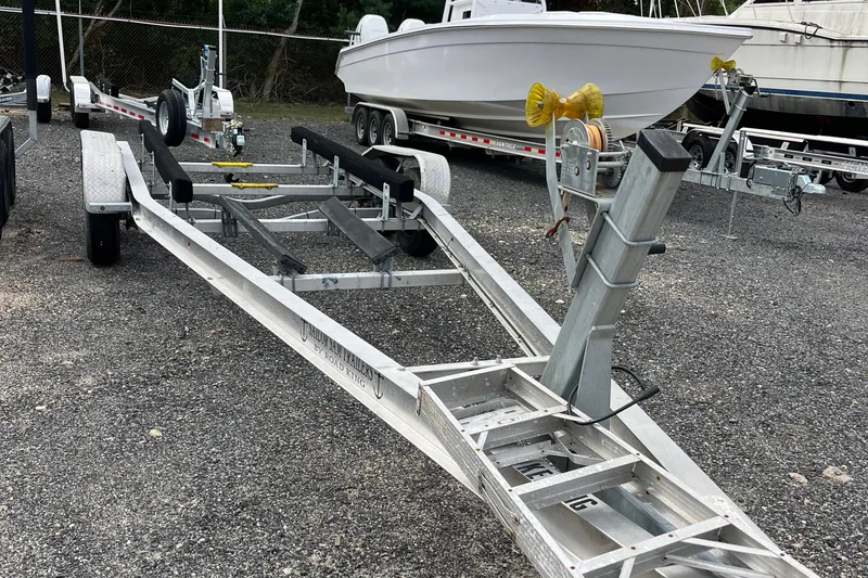 Slide: The Image of Boat trailer for 2004 Grady-White Gulfstream 232, parked on gravel lot. - 43