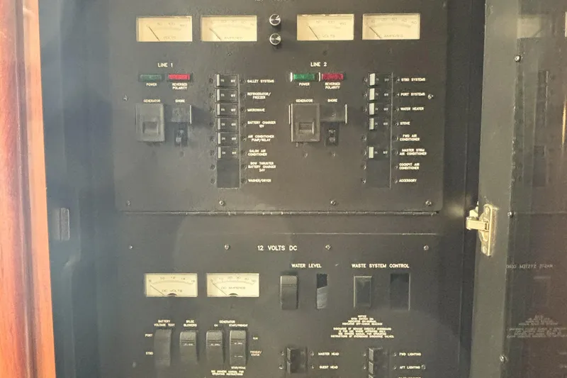 Slide: The Image of Electrical control panel of a 2005 Sea Ray 420 Sundancer boat. - 14