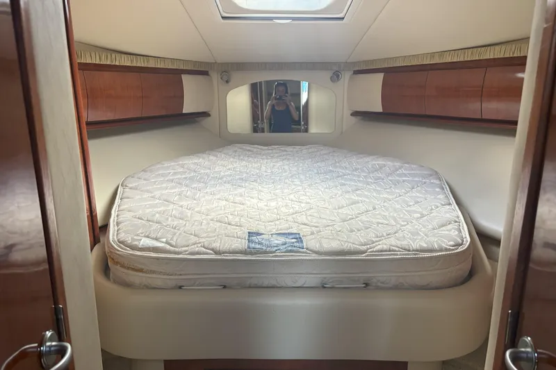 Slide: The Image of Luxurious cabin interior of 2005 Sea Ray 420 Sundancer yacht with comfortable bed. - 21