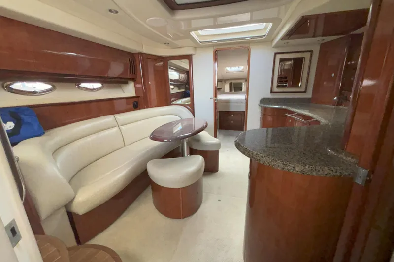Slide: The Image of Luxurious interior of 2005 Sea Ray 420 Sundancer yacht with elegant seating and modern amenities. - 22