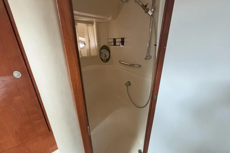 Slide: The Image of Shower area inside 2005 Sea Ray 420 Sundancer yacht, featuring modern fixtures. - 25