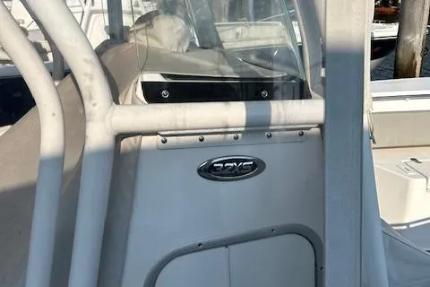 Slide: The Image of 2023 Cape Horn 32 XS boat console with logo, docked in sunlight. - 13