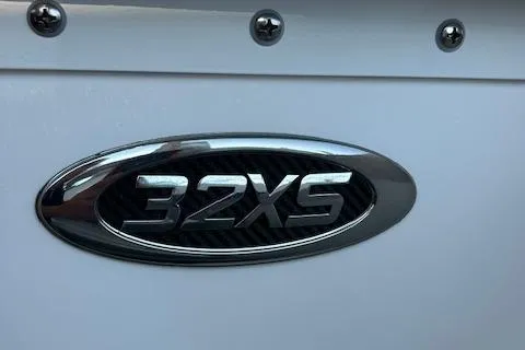 Slide: The Image of 2023 Cape Horn 32 XS boat emblem on white surface. - 2