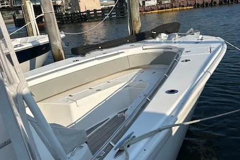 Slide: The Image of 2023 Cape Horn 32 XS boat docked at marina, showcasing spacious deck design. - 12