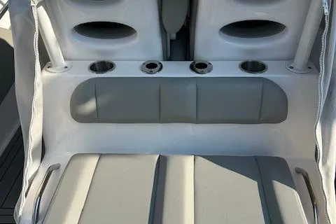 Slide: The Image of 2023 Cape Horn 32 XS boat seating with cup holders and storage compartments. - 7