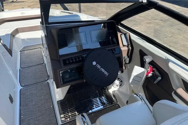 Slide: The Image of 2026 Cobalt R6 Outboard boat cockpit with modern controls and steering wheel cover. - 17