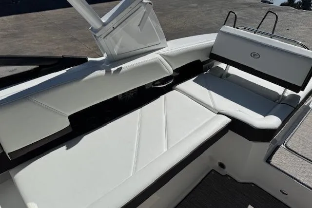 Slide: The Image of 2026 Cobalt R6 Outboard boat interior with white seating and sleek design. - 21