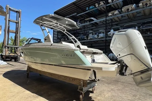 Slide: The Image of 2026 Cobalt R6 Outboard boat in storage, featuring sleek design and powerful engine. - 5