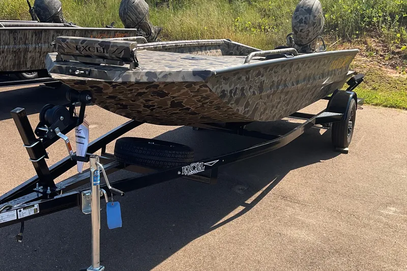 Slide: The Image of 2026 Excel 1651 Viper F4 boat with camouflage design on a trailer. - 2