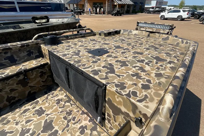 Slide: The Image of Camouflage-patterned 2026 Excel 1651 Viper F4 boat with storage compartments and light bar. - 4