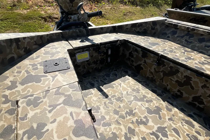 Slide: The Image of Camouflage interior of 2026 Excel 1651 Viper F4 boat, featuring rugged design and storage compartments. - 7