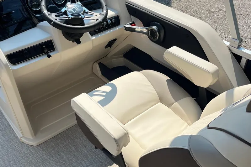 Slide: The Image of 2026 Avalon 23 LSZ Cruise Rear Bench boat interior with steering wheel and beige seating. - 5