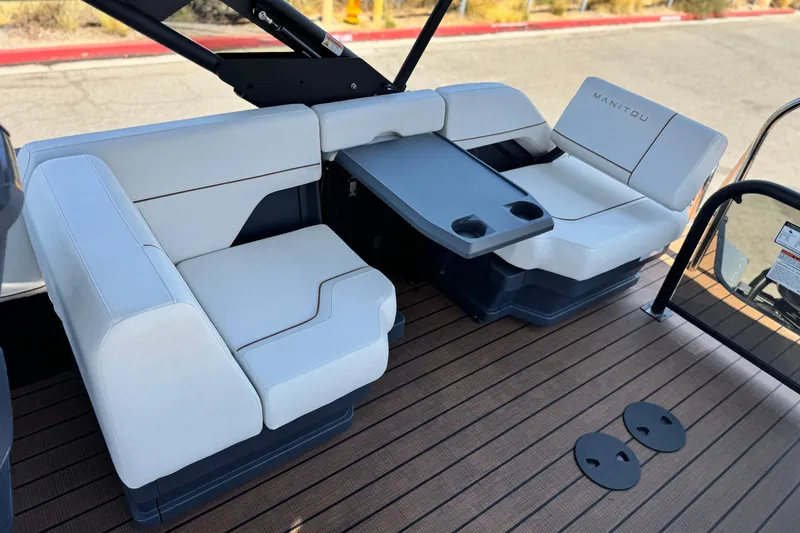 Slide: The Image of Luxurious seating on 2025 Manitou EXPLORE 26 boat with sleek design and modern amenities. - 17