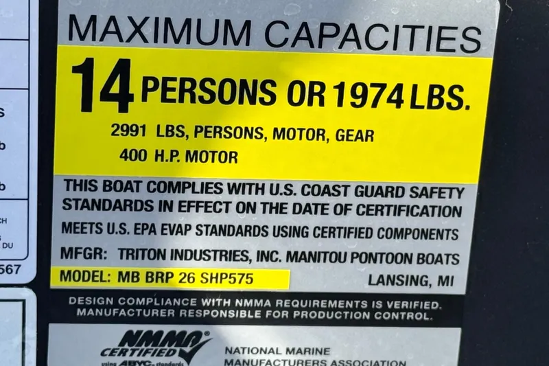 Slide: The Image of 2025 Manitou EXPLORE 26 capacity label: 14 persons, 1974 lbs, 400 HP motor. - 26