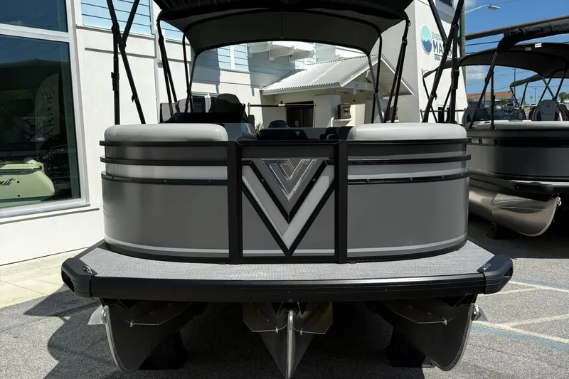 Slide: The Image of 2026 Viaggio Lago X-C pontoon boat, sleek design, docked outdoors. - 1