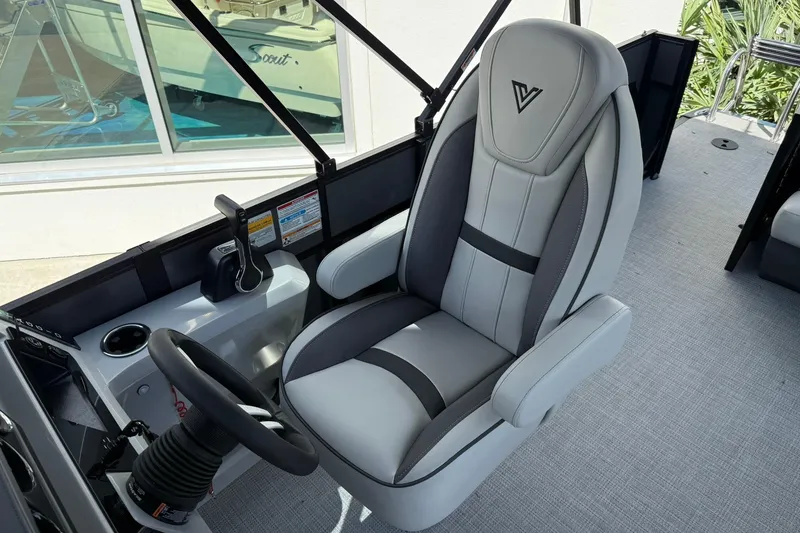 Slide: The Image of Captain's chair in 2026 Viaggio Lago X-C boat, featuring sleek design and modern controls. - 9