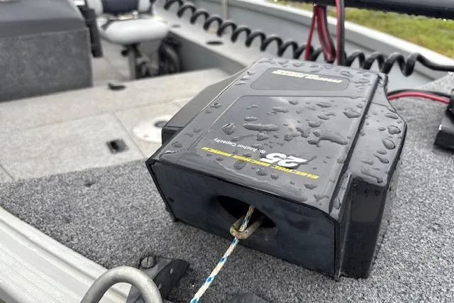 Slide: The Image of 2014 Alumacraft Escape 165 CS boat interior with wet rope and equipment. - 14