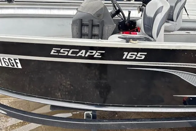 Slide: The Image of 2014 Alumacraft Escape 165 CS boat, black exterior, side view. - 6