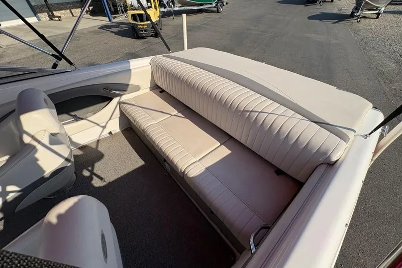 Slide: The Image of 2008 Chaparral 180 SSi boat interior with beige seating and carpeted floor. - 4