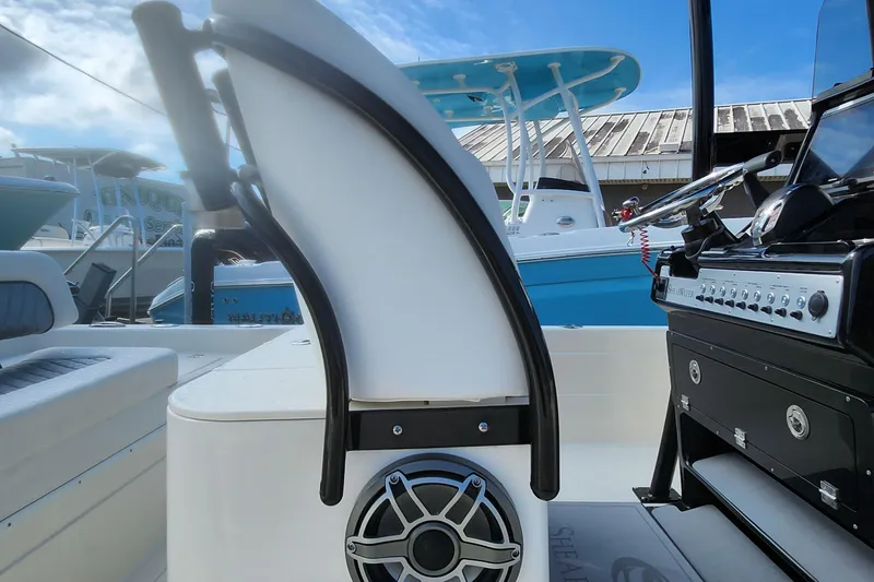 Slide: The Image of 2026 ShearWater 25 LTD boat interior with modern console and seating, showcasing sleek design. - 6