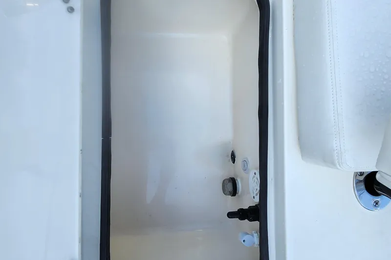Slide: The Image of Interior compartment of 2026 ShearWater 25 LTD boat, featuring clean white finish. - 9