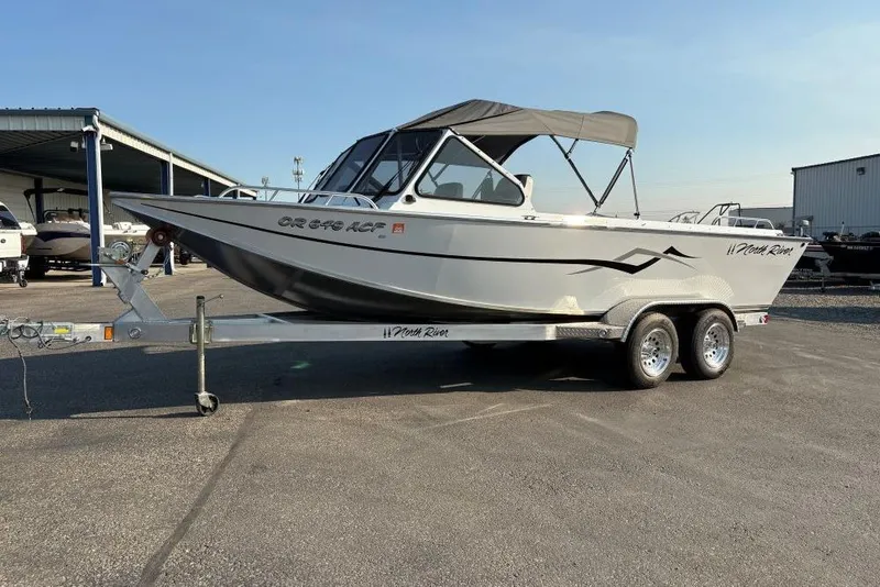 Slide: The Image of 2006 North River 21 Commander 212 Pump boat on trailer, parked outdoors. - 1