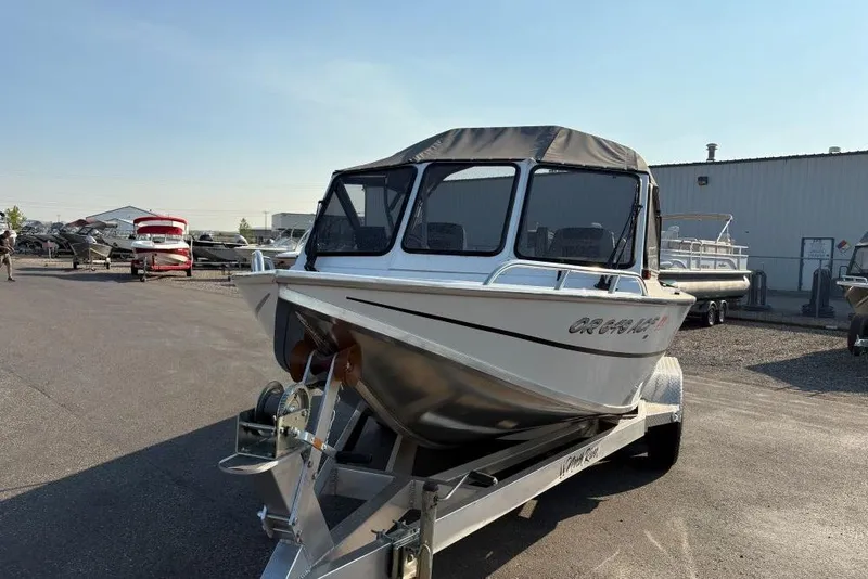 Slide: The Image of 2006 North River 21 Commander 212 Pump boat on trailer in outdoor lot. - 2