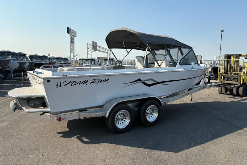 Slide: The Image of 2006 North River 21 Commander 212 Pump boat on trailer, parked outdoors. - 4