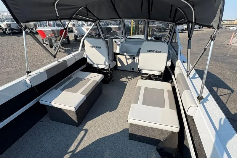 Slide: The Image of 2006 North River 21 Commander 212 Pump boat interior with seating and canopy. - 5