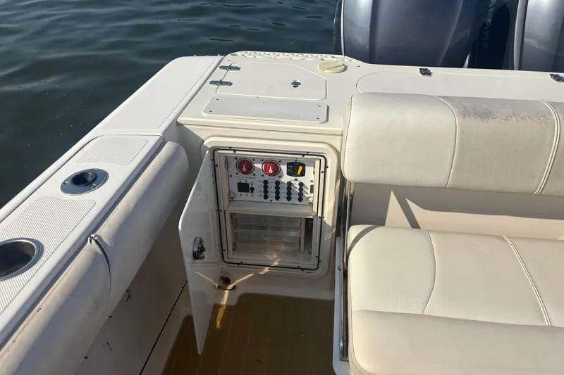 Slide: The Image of 2011 Pursuit S 280 Sport boat interior with control panel and seating. - 20