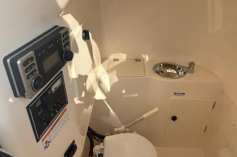 Slide: The Image of 2011 Pursuit S 280 Sport boat interior with control panel and sink. - 35