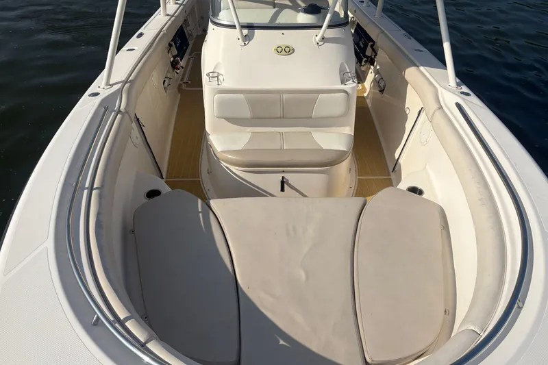 Slide: The Image of 2011 Pursuit S 280 Sport boat interior with cushioned seating and steering console. - 39