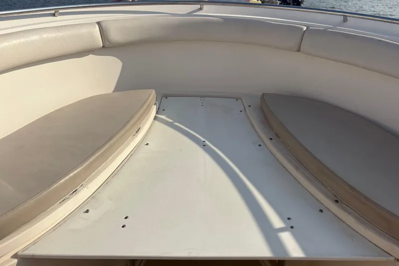 Slide: The Image of 2011 Pursuit S 280 Sport boat interior with cushioned seating and open deck. - 41
