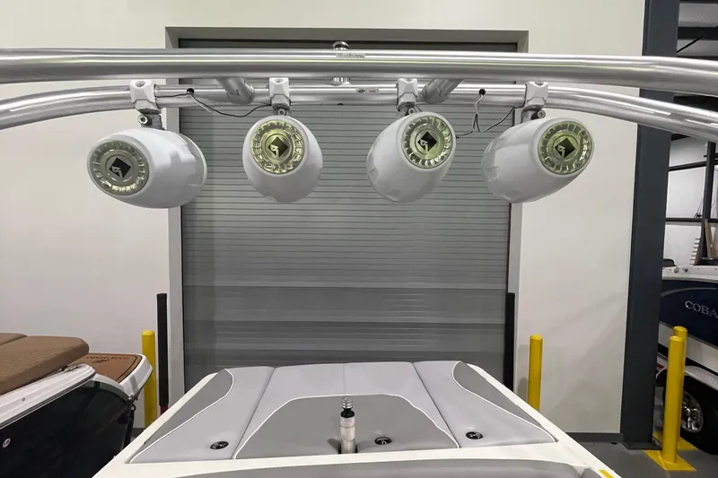 Slide: The Image of 2007 Centurion Cyclone C4 boat with mounted speakers in a garage setting. - 11