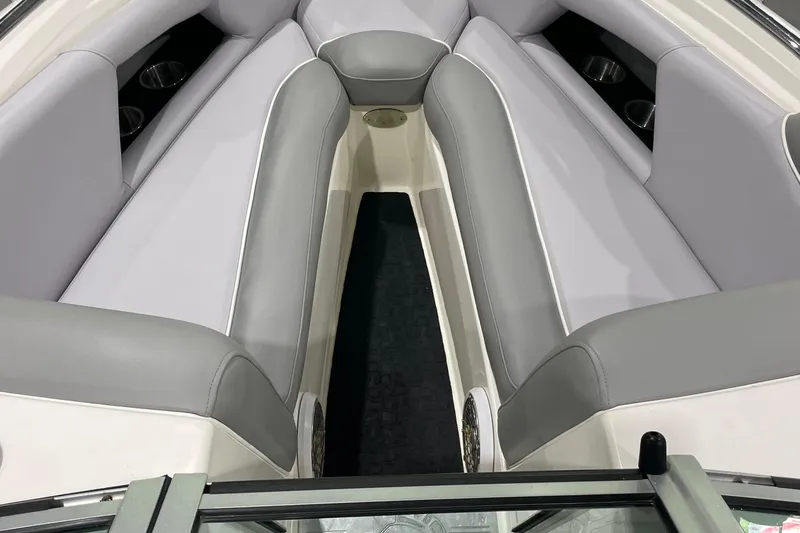Slide: The Image of 2007 Centurion Cyclone C4 boat interior with gray seating and cup holders. - 12