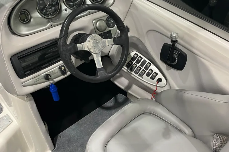 Slide: The Image of 2007 Centurion Cyclone C4 boat dashboard with steering wheel and control panel. - 13