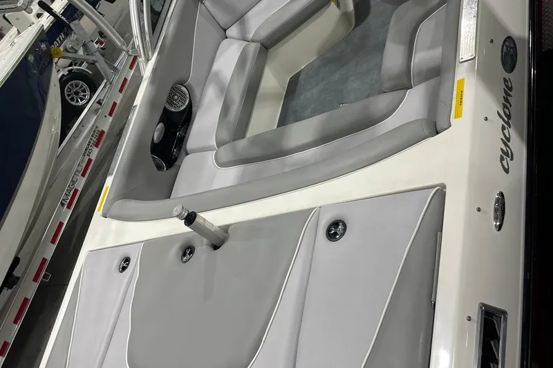 Slide: The Image of 2007 Centurion Cyclone C4 boat interior with gray seating and speaker system. - 3