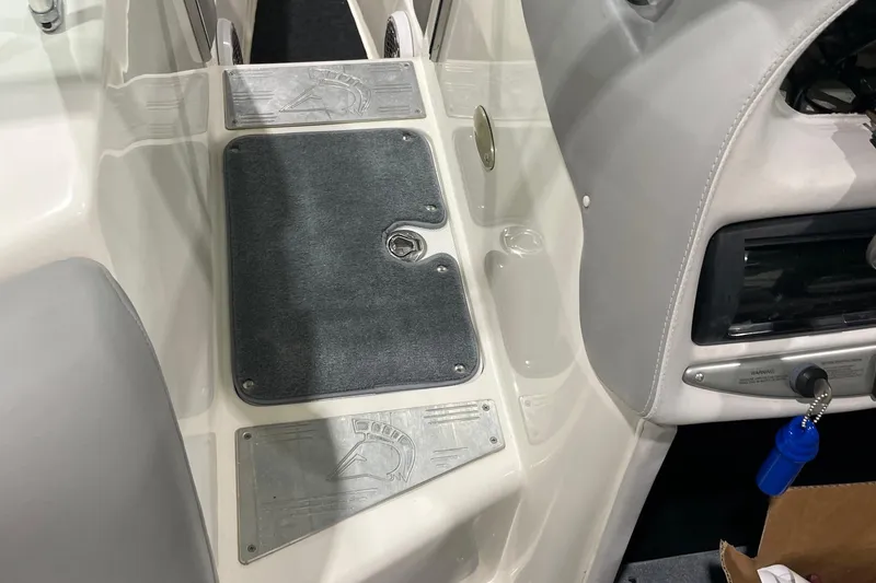 Slide: The Image of 2007 Centurion Cyclone C4 boat interior with gray carpet and control panel. - 7