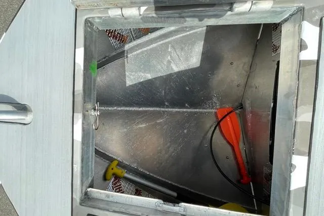 Slide: The Image of Open hatch of 2023 RSRRacecraft Rouge 16, showing interior with tools and equipment. - 11