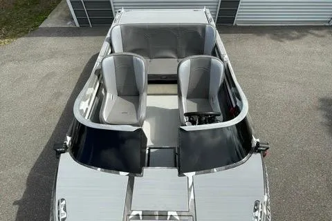 Slide: The Image of 2023 RSRRacecraft Rouge 16, sleek silver design, top view of modern interior. - 4