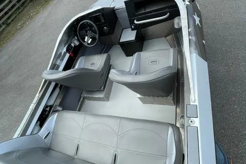 Slide: The Image of 2023 RSRRacecraft Rouge 16 interior with gray seating and steering wheel. - 6