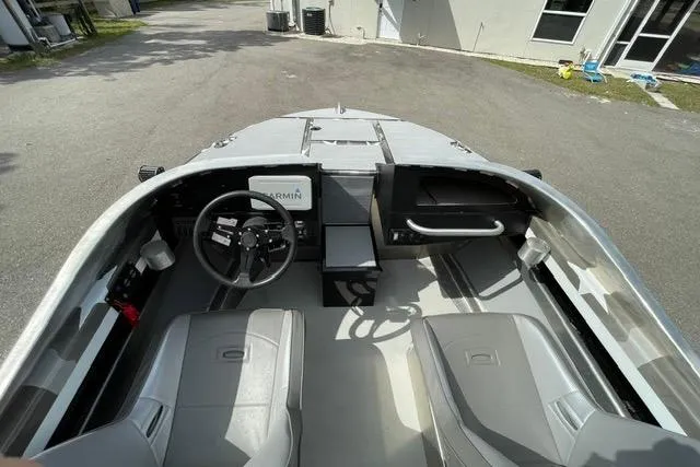 Slide: The Image of 2023 RSRRacecraft Rouge 16 boat interior with steering wheel and seating. - 7
